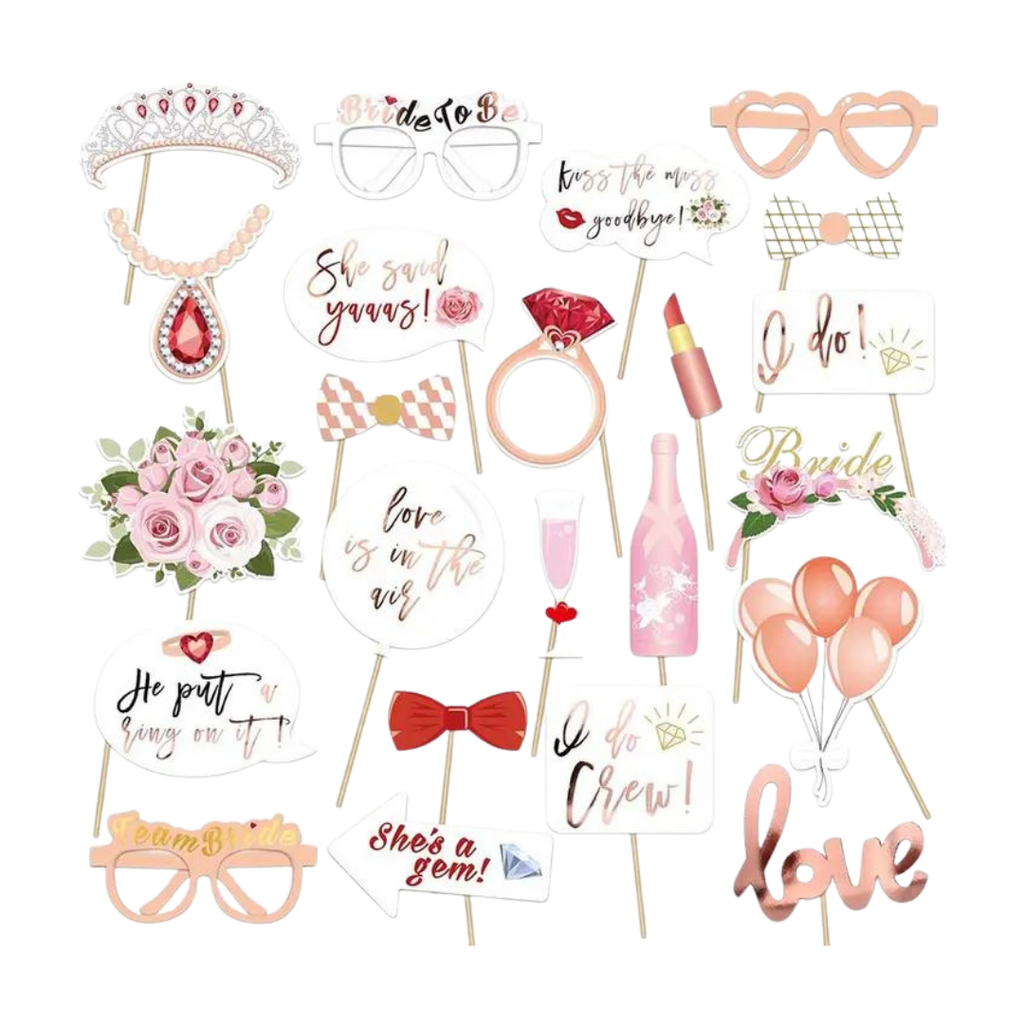Pink and gold bridal photo props with glasses rings lips and floral designs for wedding from Parte Haus party supply store in Bethesda Maryland