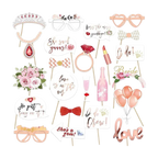 Pink and gold bridal photo props with glasses rings lips and floral designs for wedding from Parte Haus party supply store in Bethesda Maryland