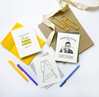 White and yellow wedding congrats card with champagne glasses theme from Parte Haus party supply store in Bethesda MD