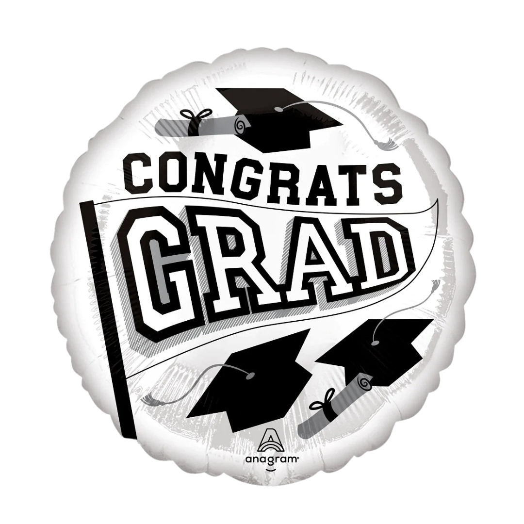White graduation balloon with black caps and diplomas for graduation from Parte Haus party supply store in Bethesda MD.