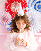 White and rainbow stripes birthday cup with party hat at birthday from Parte Haus party supply store in Bethesda MD