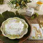 White and green scalloped baby safari appetizer dessert plates with animal designs for first birthday from Parte Haus party supply store in Bethesda MD