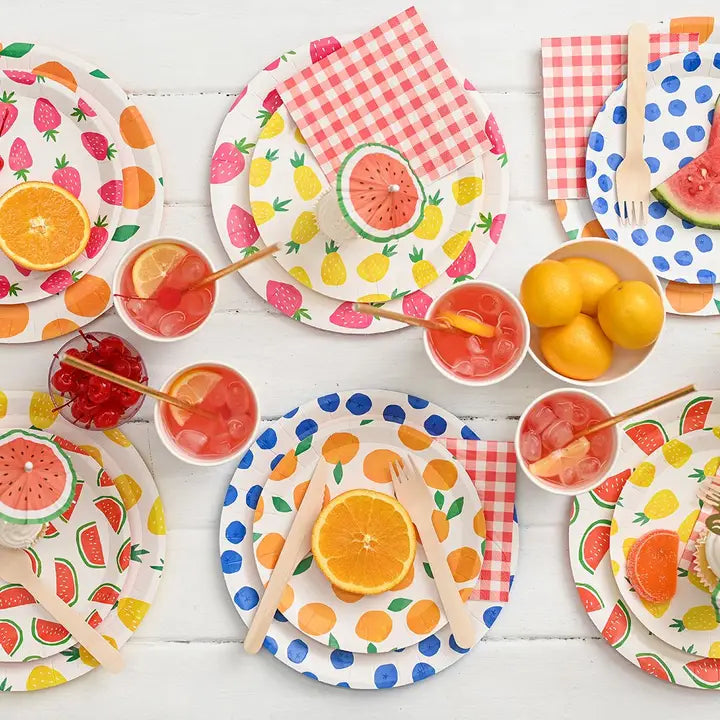 Natural wooden cutlery set on colorful fruit plates summer picnic from Parte Haus party supply store in Bethesda MD