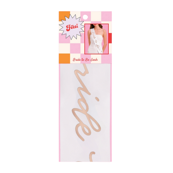 White bride to be sash with gold lettering for bachelorette from Parte Haus party supply store in Bethesda Maryland