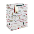 White Christmas gift bag with red and gold festive text and stag from Parte Haus party supply store in Bethesda MD