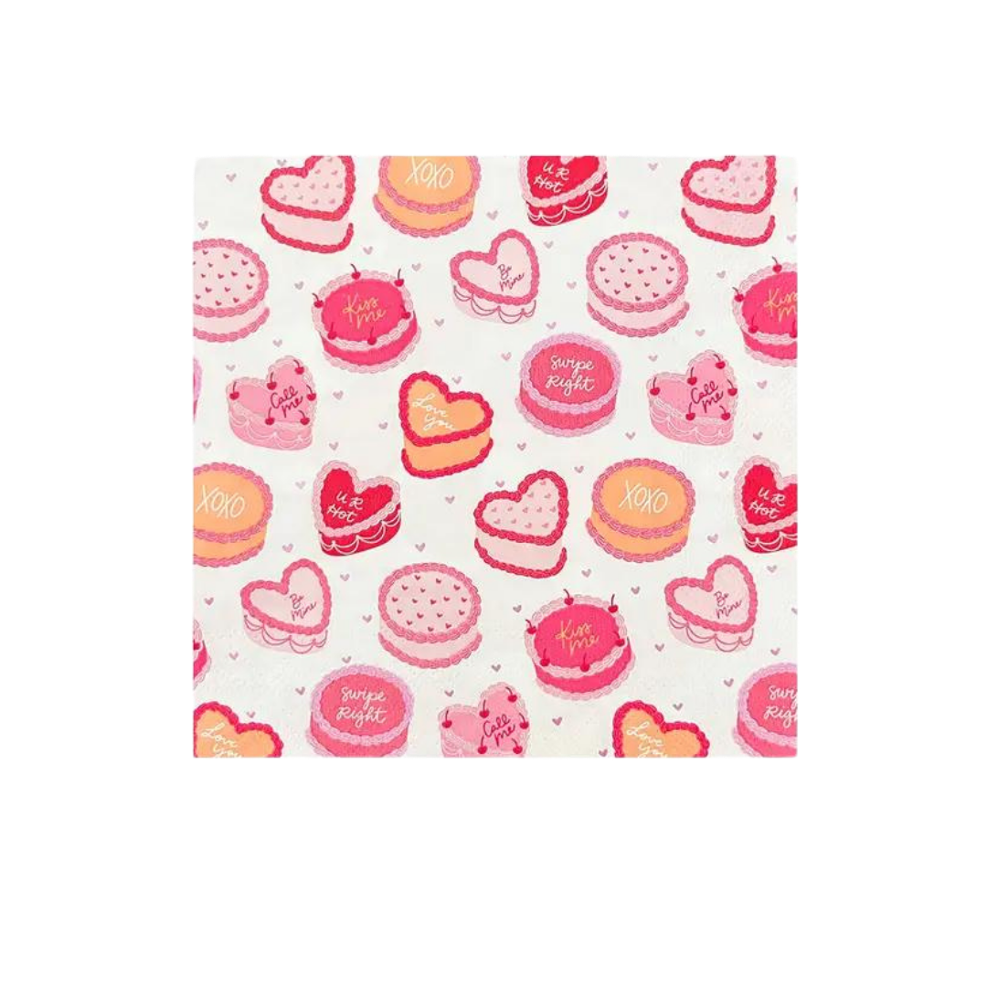 Pink and red large napkin with heart cakes and sweet sayings Valentine’s Day from Parte Haus party supply store in Bethesda MD
