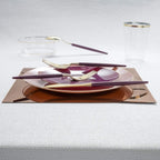 Purple and gold plastic dinnerware and cutlery elegant table setting for celebration from Parte Haus party supply store in Bethesda MD