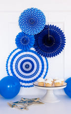 Blue paper fans and balloons dessert table with cupcakes birthday theme from Parte Haus party supply store in Bethesda Maryland