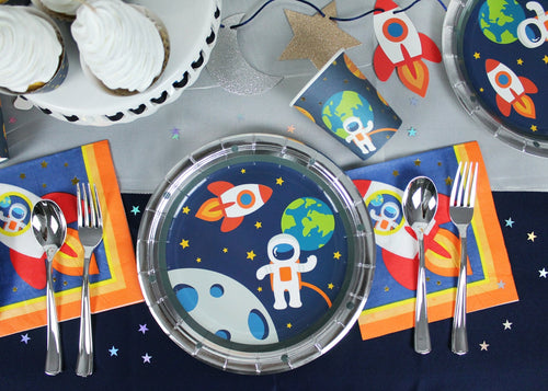 Blue space astronaut plates and napkins with rocket design kids birthday from Parte Haus party supply store in Bethesda MD