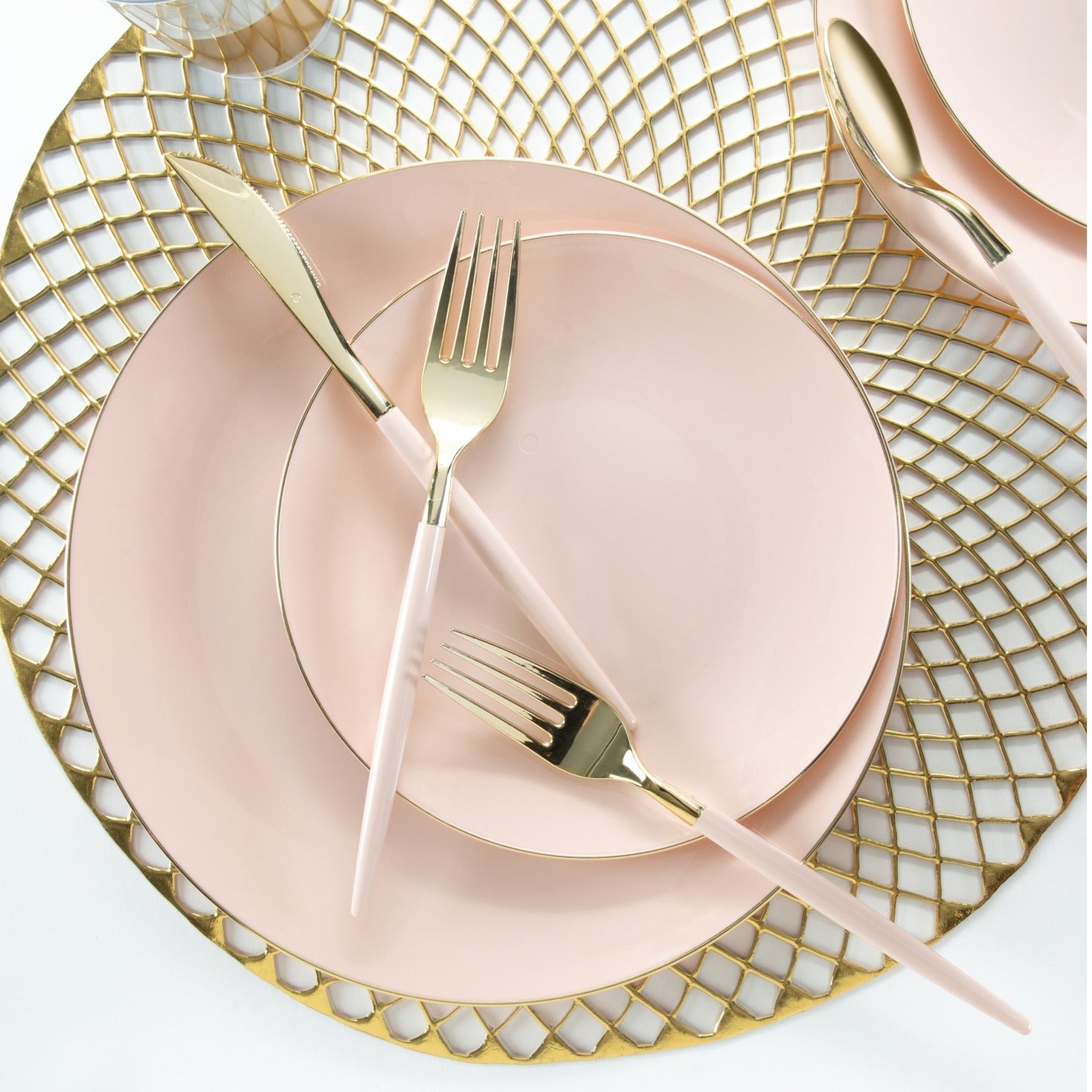 Blush pink dinnerware set with gold flatware and lattice charger elegant dining from Parte Haus party supply store in Bethesda MD.