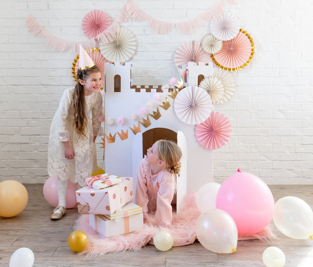 Pink and gold castle backdrop kids birthday decorations with balloons from Parte Haus party supply store in Bethesda Maryland