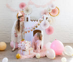 Pink and gold castle backdrop kids birthday decorations with balloons from Parte Haus party supply store in Bethesda Maryland