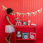 Red and green gift box decorations Christmas table setup from Parte Haus party supply store in Bethesda Maryland