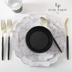 Black and marble dinnerware set with gold cutlery elegant table setting from Parte Haus party supply store in Bethesda Maryland