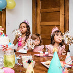 Pink birthday hats and tiaras with confetti and treats for kids birthday from Parte Haus party supply store in Bethesda MD