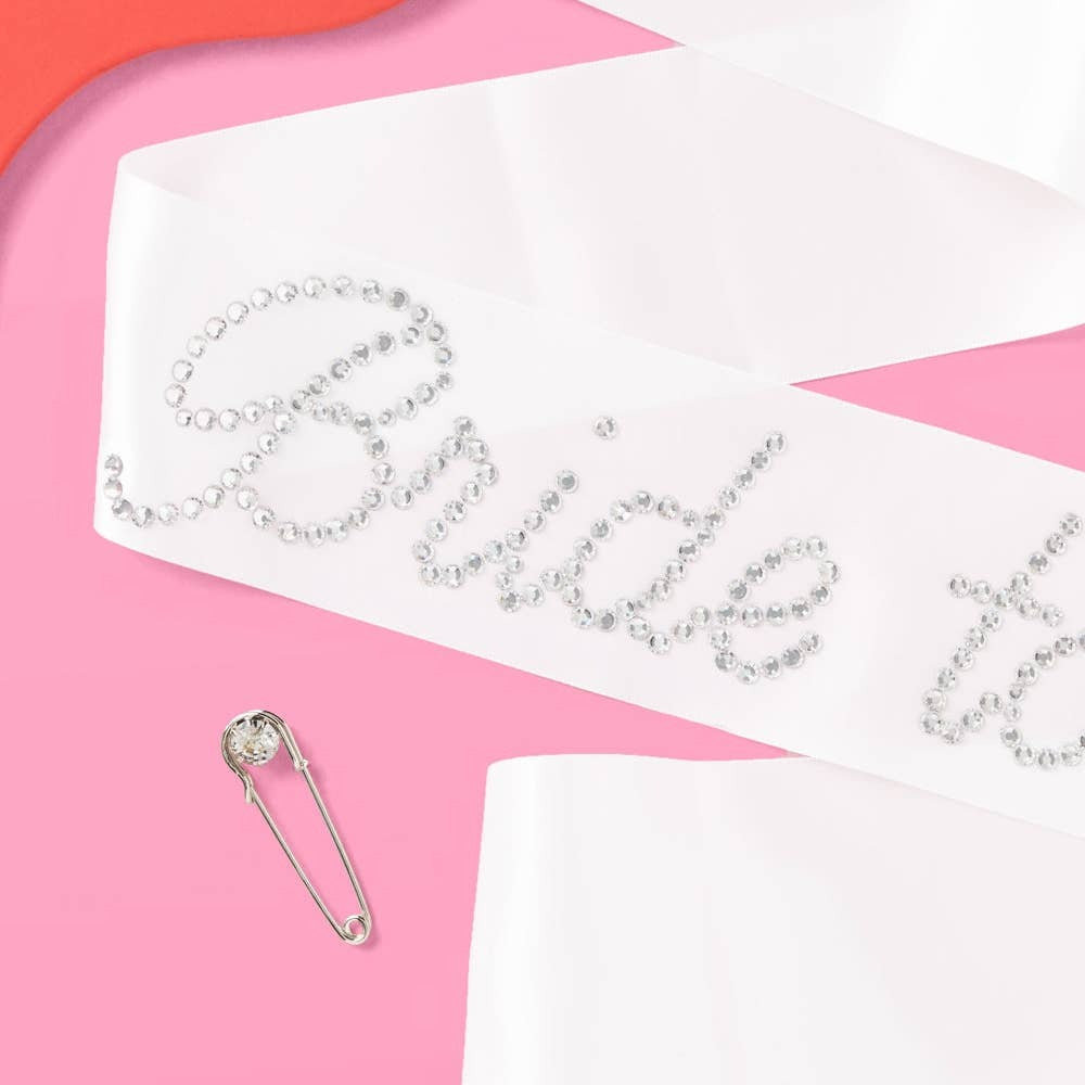 White rhinestone bride to be sash for bridal shower from Parte Haus party supply store in Bethesda MD