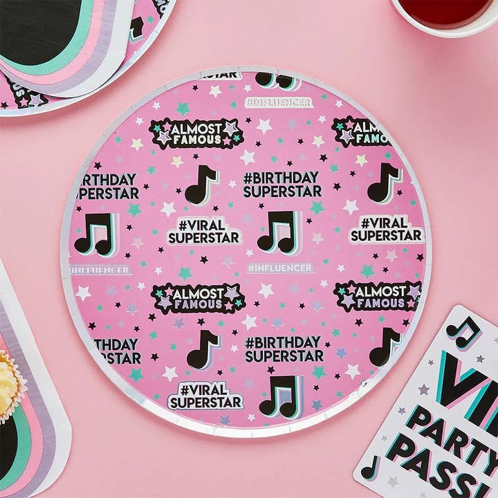 Pink influencer themed round paper plate with music notes and stars for birthday party from Parte Haus party supply store in Bethesda, MD