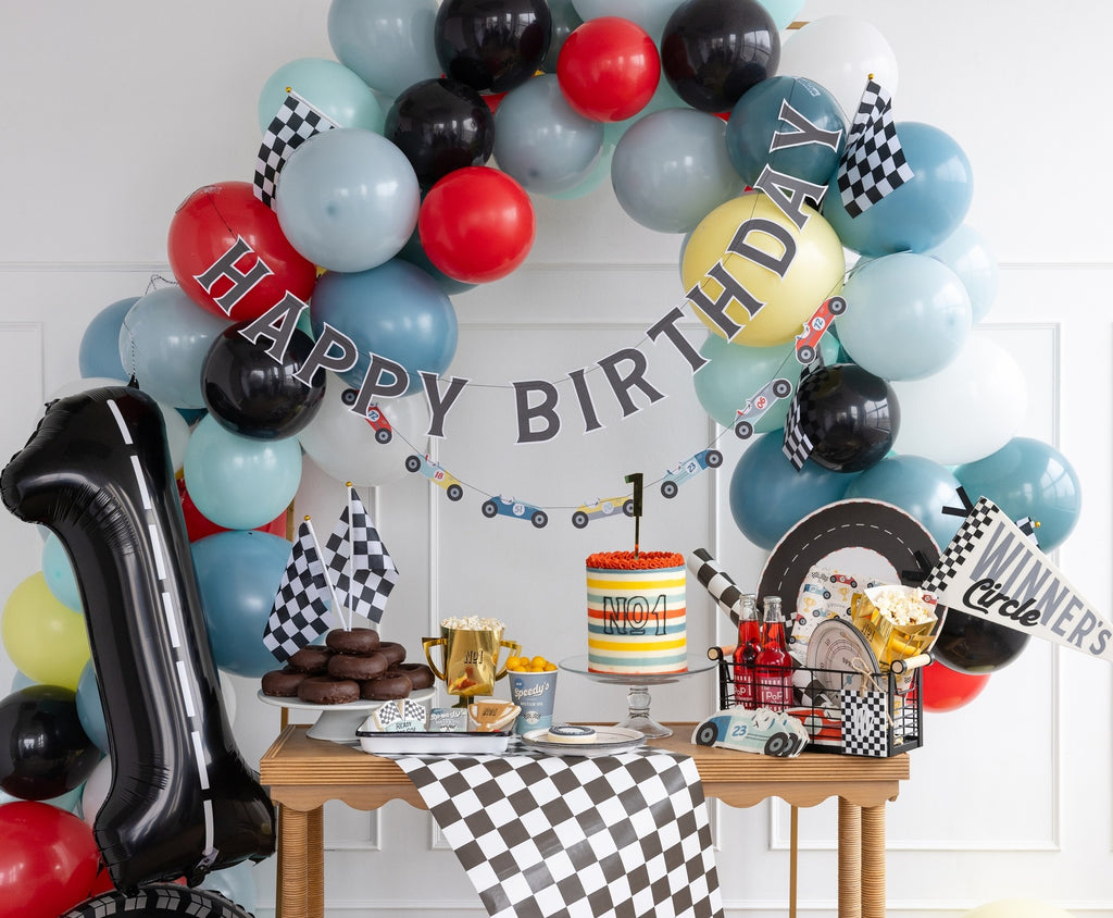 Red blue black racing birthday balloon arch and checkered decor for kids birthday from Parte Haus party supply store in Bethesda MD