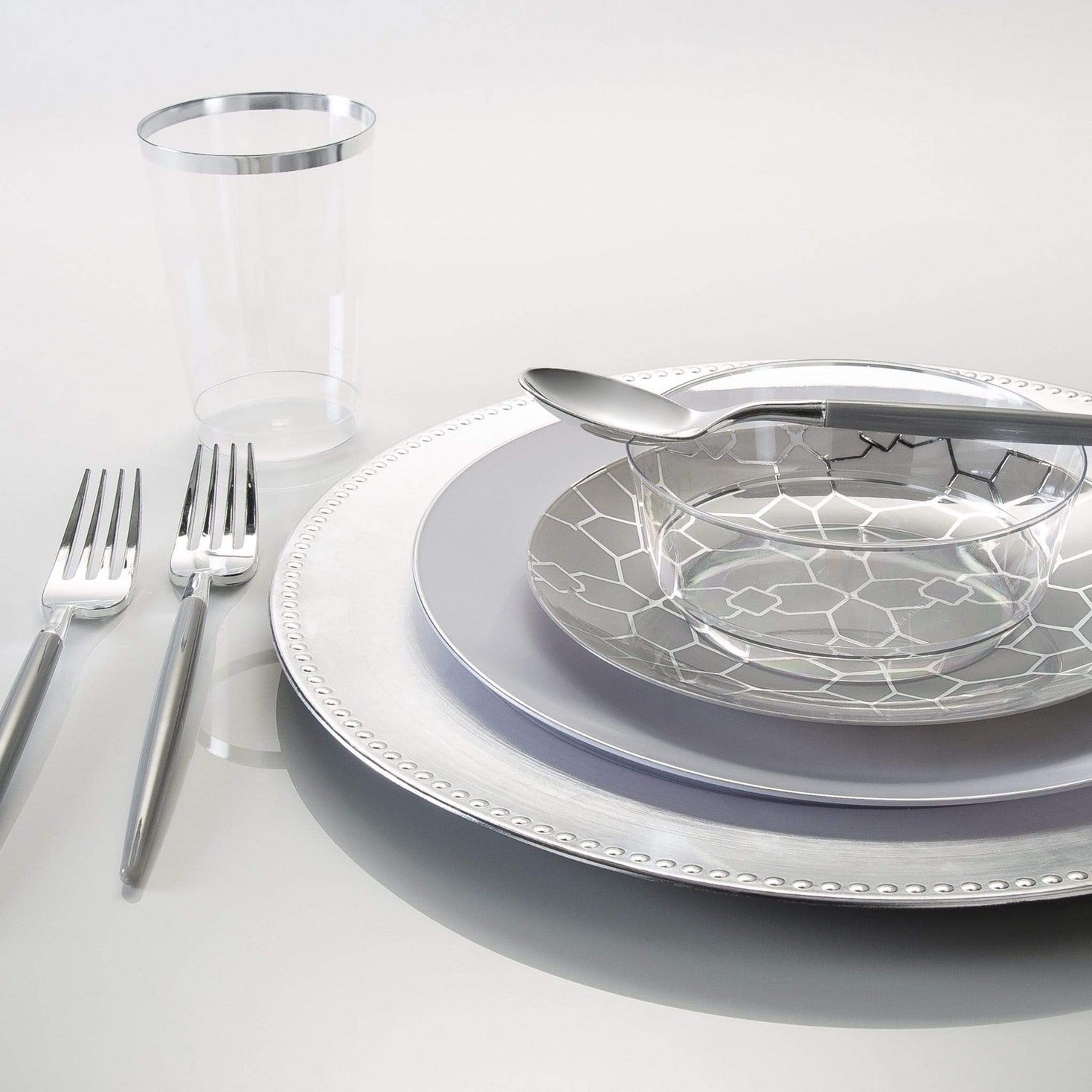 Silver and clear plastic dinnerware set with geometric design for elegant event from Parte Haus party supply store in Bethesda MD