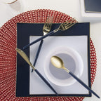 Navy blue and gold cutlery with square plates on red placemat elegant celebration from Parte Haus party supply store in Bethesda MD.