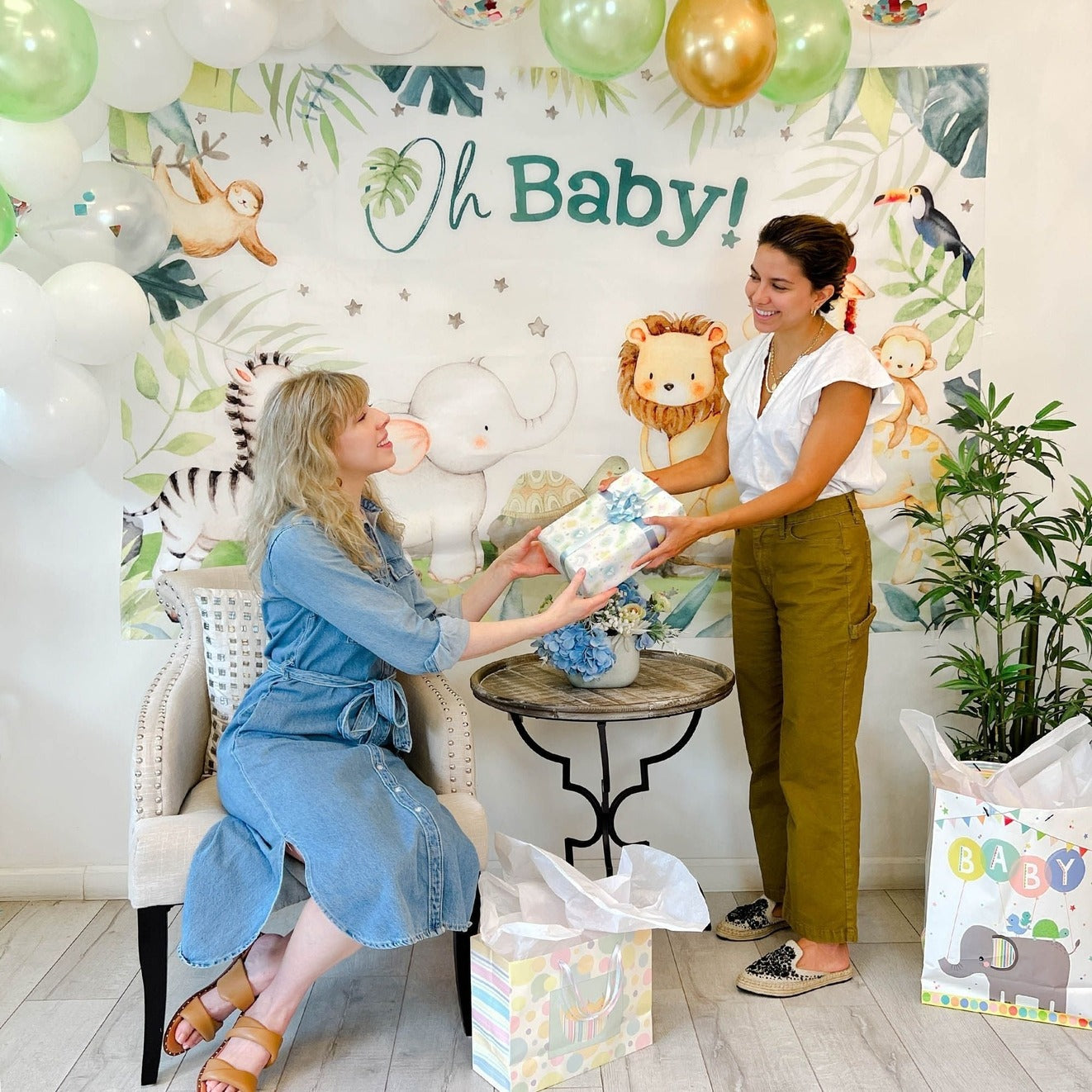 pastel baby shower gift table with animal theme decorations from Parte Haus party supply store in Bethesda MD