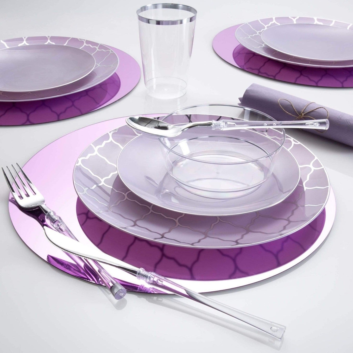 Purple plastic plates and bowls set with clear utensils for celebrations from Parte Haus party supply store in Bethesda Maryland