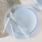 Light blue dinnerware set with white handled cutlery modern metallic placemat event from Parte Haus party supply store in Bethesda MD