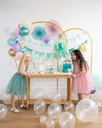 Teal and pink birthday decorations with balloons and kids from Parte Haus party supply store in Bethesda MD