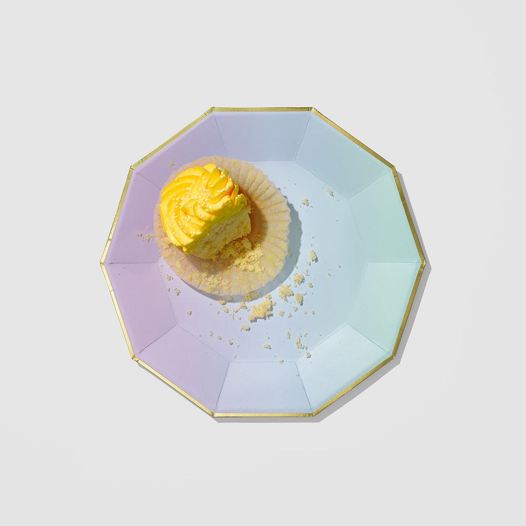 Pastel iridescent plate with gold edge holding yellow frosted cupcake for birthday from Parte Haus party supply store in Bethesda Maryland