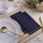 Navy blue napkins with gold trim elegant table setting for dinner from Parte Haus party supply store in Bethesda Maryland