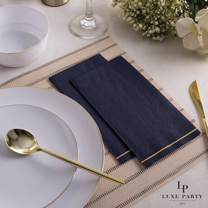 Navy blue napkins with gold trim elegant table setting for dinner from Parte Haus party supply store in Bethesda Maryland