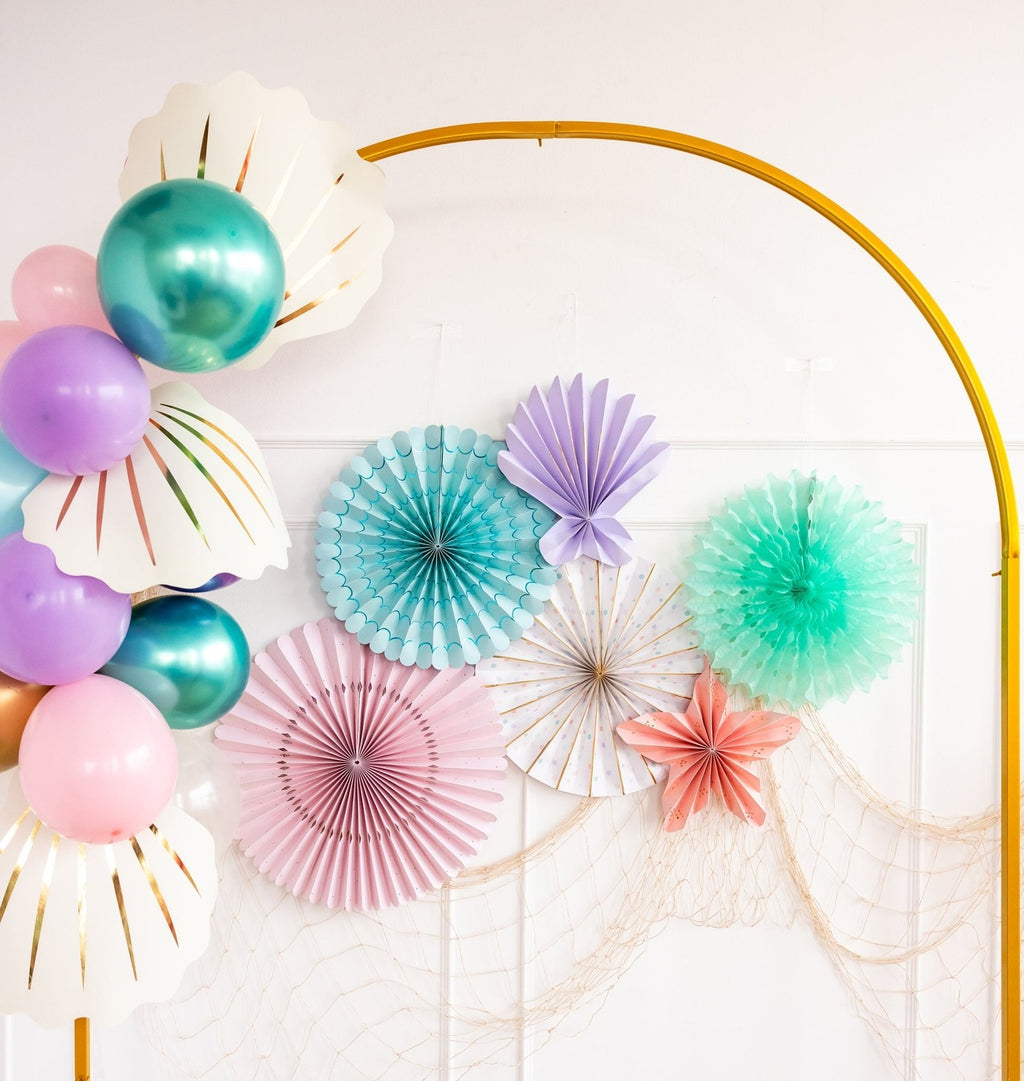 Pastel mermaid balloon arch and paper fans underwater birthday theme from Parte Haus party supply store in Bethesda MD