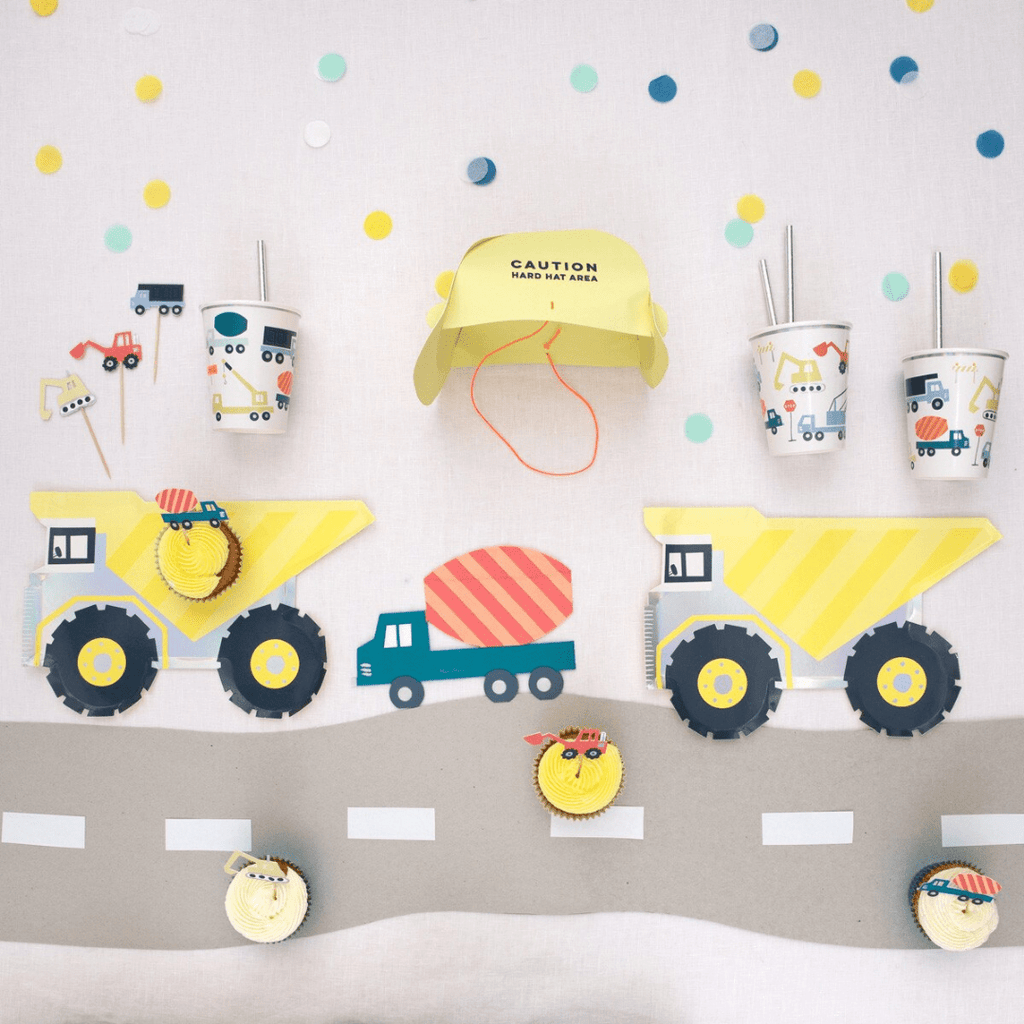 Yellow construction theme kids party set with trucks cups cupcakes and hard hat from Parte Haus party supply store in Bethesda Maryland
