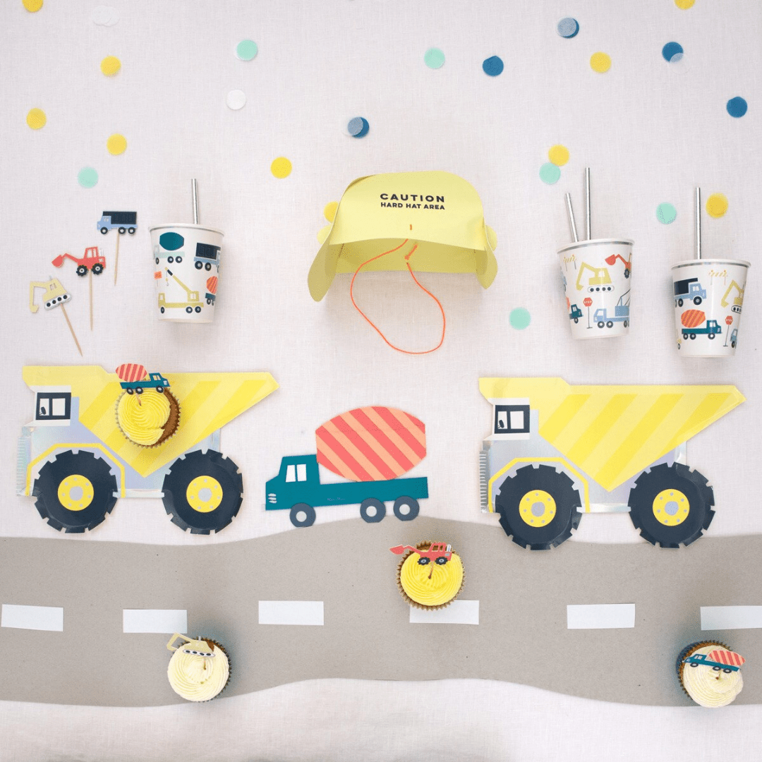 Yellow construction theme kids party set with trucks cups cupcakes and hard hat from Parte Haus party supply store in Bethesda Maryland