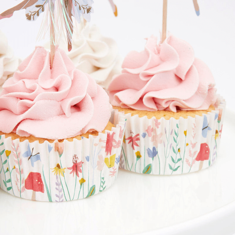 Pastel floral cupcake wrappers with pink frosting perfect for spring from Parte Haus party supply store in Bethesda MD.