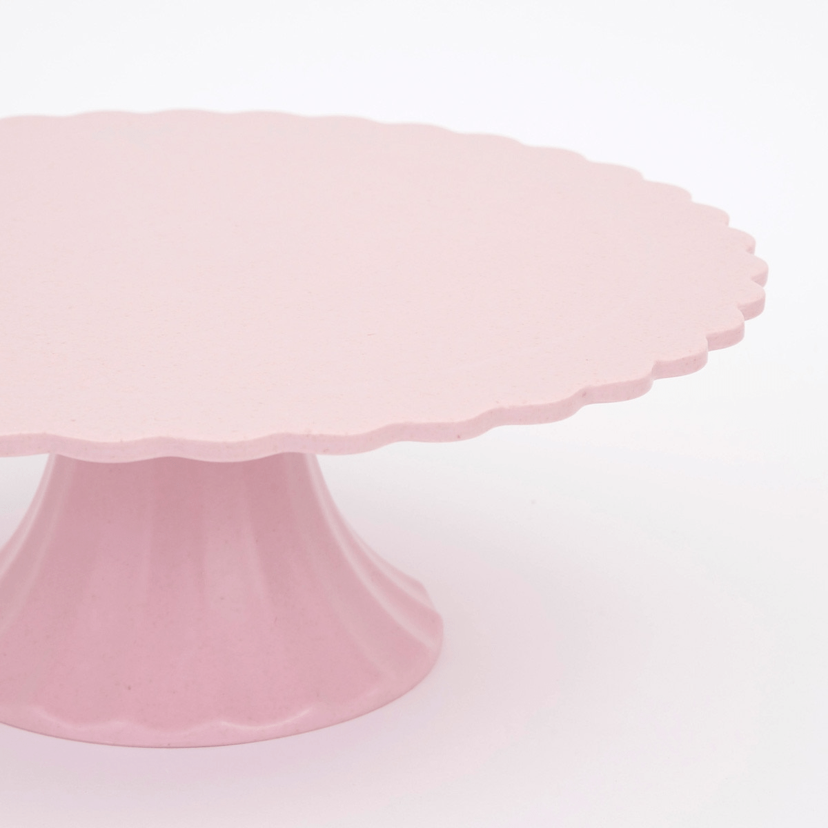 Pink cake stand with scalloped edge for birthday decor from Parte Haus party supply store in Bethesda Maryland