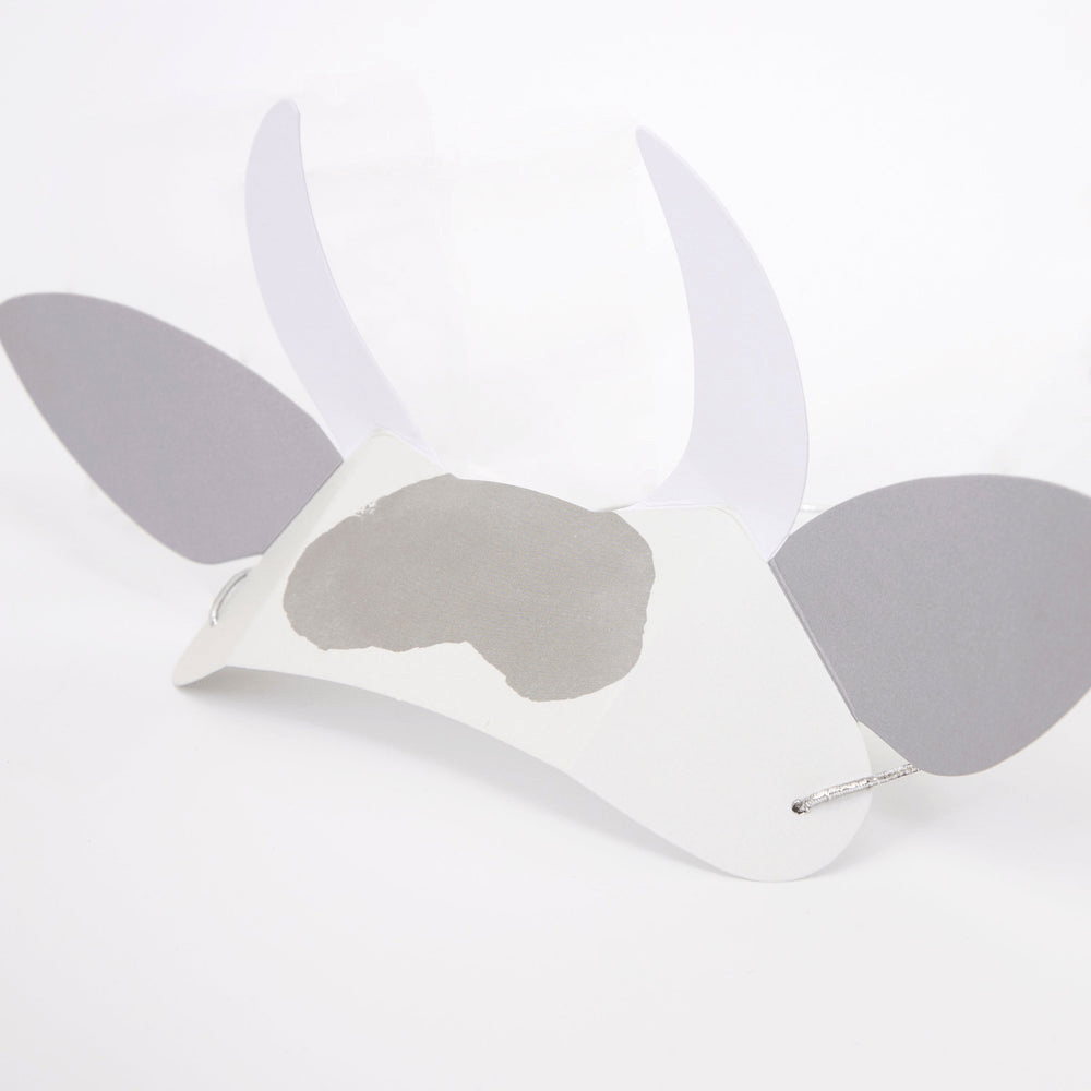 Gray and white cow mask with ears and horns animal theme from Parte Haus party supply store in Bethesda Maryland