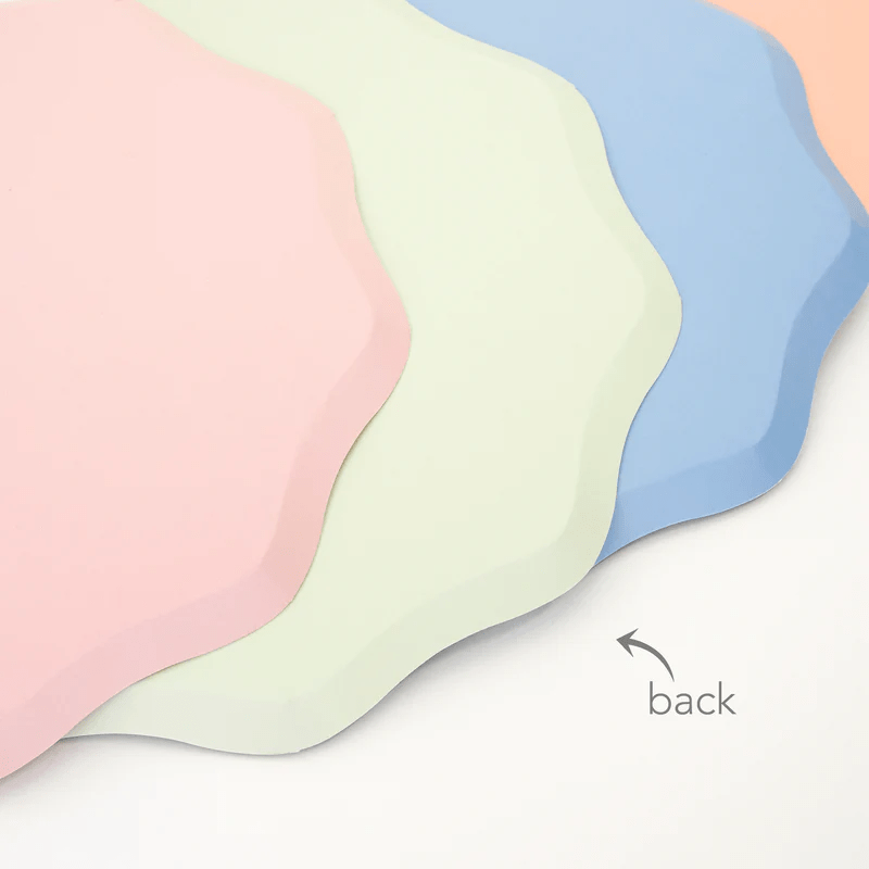 Pastel pink green and blue wavy edge placemats for birthday parties from Parte Haus party supply store in Bethesda Maryland