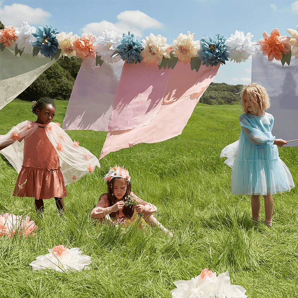 Pastel floral decorations and pink fabric for outdoor kids birthday from Parte Haus party supply store in Bethesda MD.