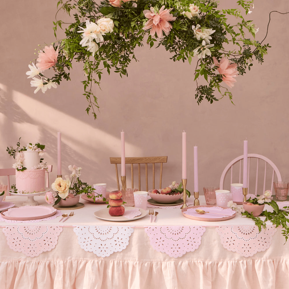 Pink and white birthday table decor with floral centerpiece and cake from Parte Haus party supply store in Bethesda Maryland