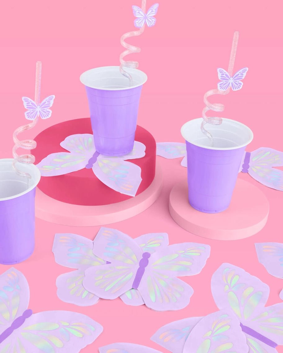 Purple butterfly cups with swirly straws birthday decor from Parte Haus party supply store in Bethesda Maryland