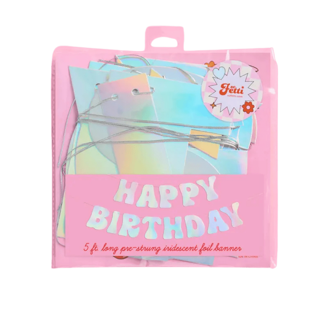 Iridescent foil Happy Birthday banner in pastel pink packaging for birthday Parte Haus party supply store in Bethesda Maryland