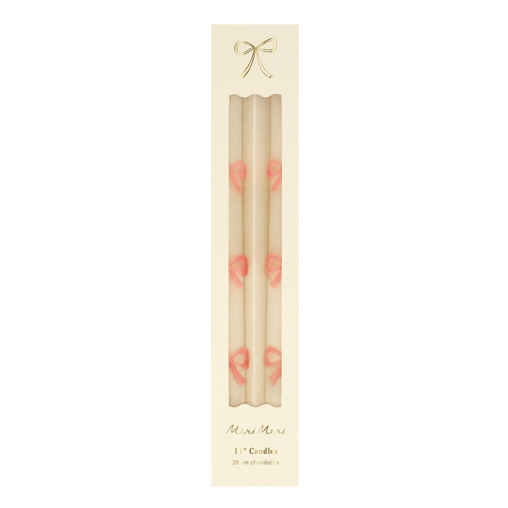 Cream bow taper candle set with pink bows boxed for birthday from Parte Haus party supply store in Bethesda MD
