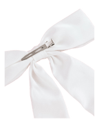White bow hair clip elegant accessory for birthday from Parte Haus party supply store in Bethesda MD