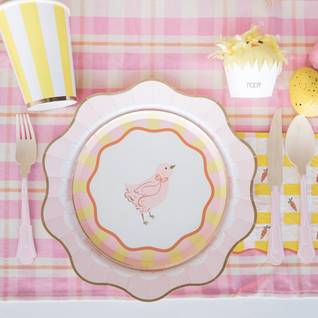 Pink yellow Easter chick paper plate and striped cup Easter table setting from Parte Haus party supply store in Bethesda MD