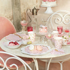 Pink tea party tableware with floral plates and macarons garden tea theme from Parte Haus party supply store in Bethesda Maryland