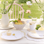 White lace paper placemat and tableware elegant table setting for garden tea party from Parte Haus party supply store in Bethesda Maryland