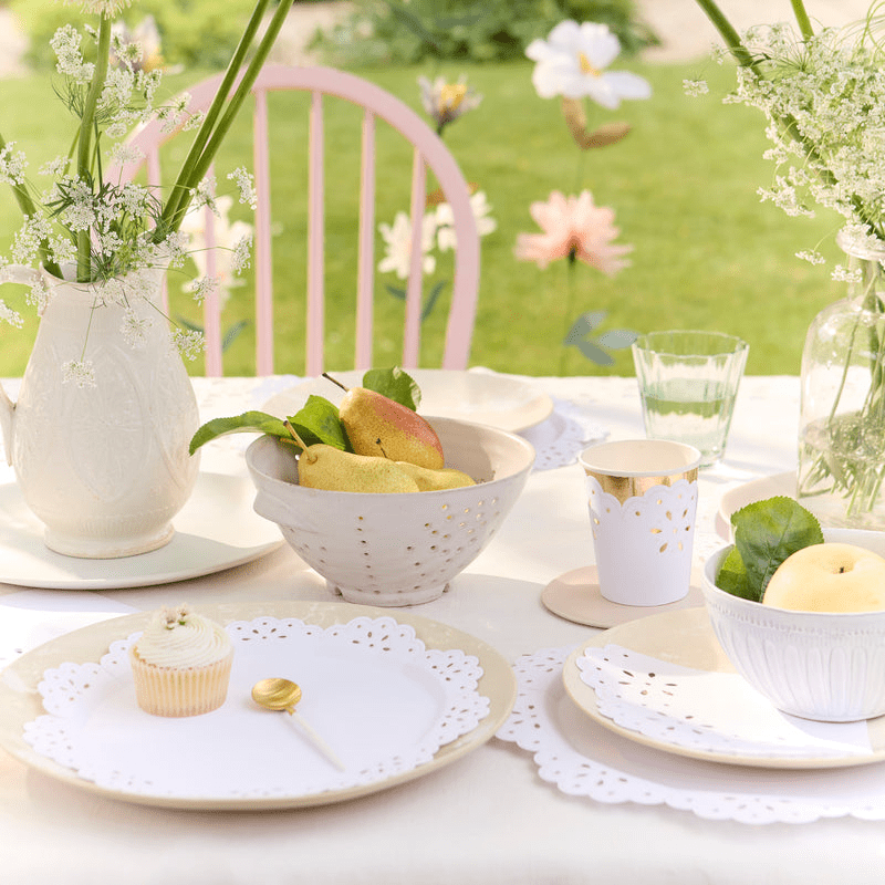 White lace paper placemat and tableware elegant table setting for garden tea party from Parte Haus party supply store in Bethesda Maryland