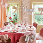 Pink and white bow decorations elegant table setting birthday theme from Parte Haus party supply store in Bethesda MD