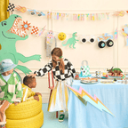 Colorful dinosaur birthday decorations kids table and wall decor from Parte Haus party supply store in Bethesda Maryland